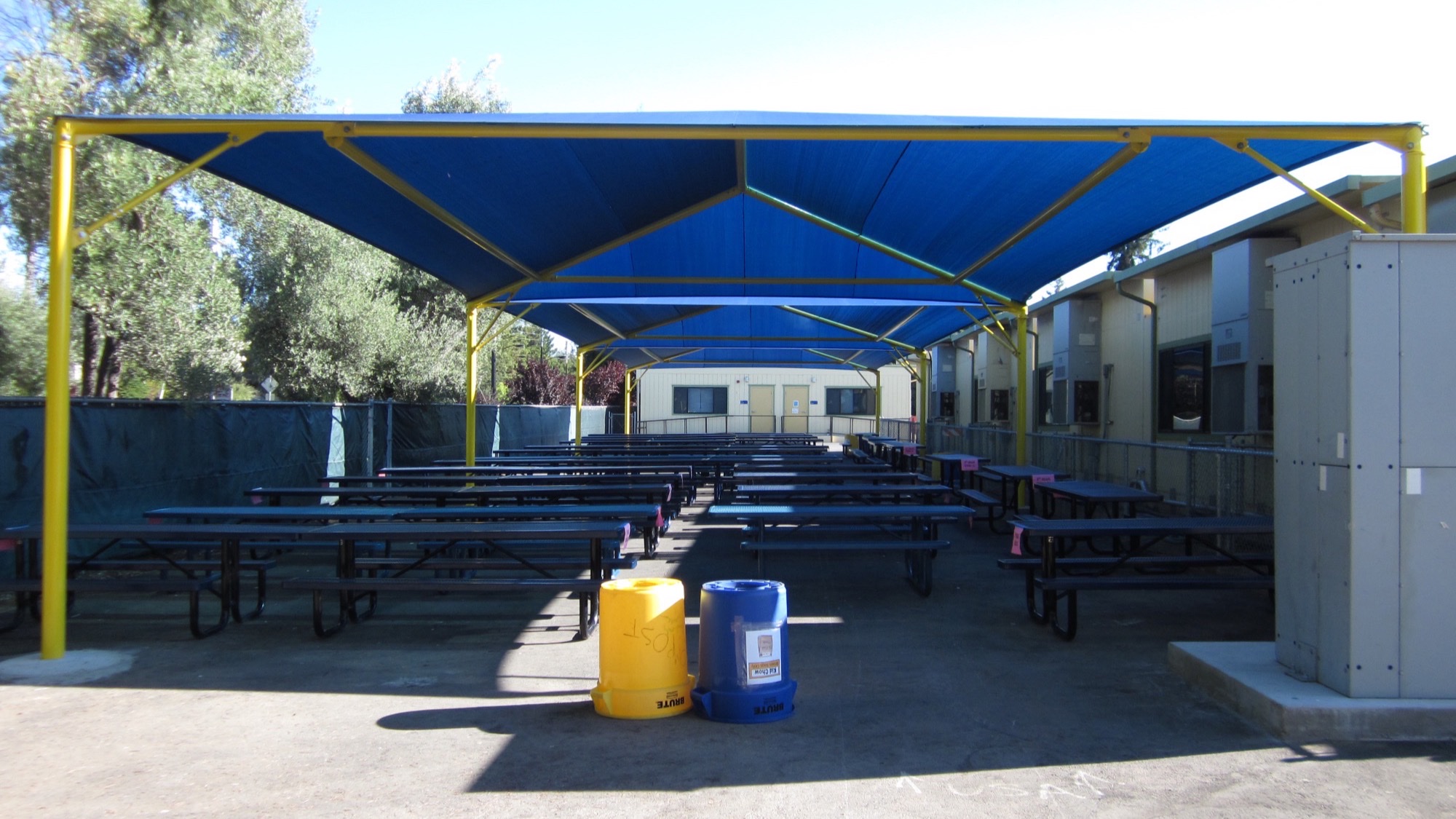DSA approved shade structures over a lunch area at a California school campus