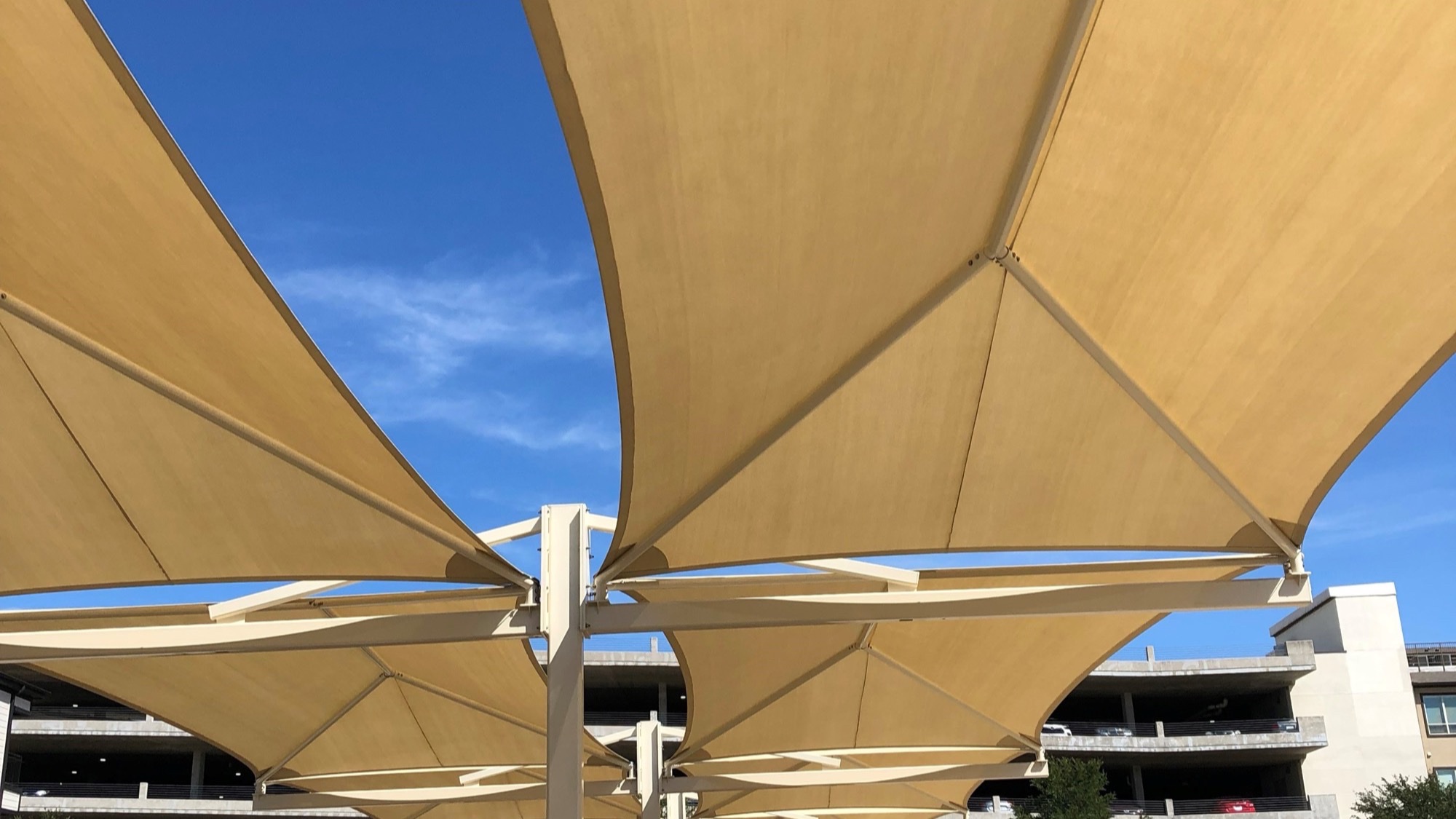 Engineered shade structure with stamped drawings supporting a cantilever sail canopy