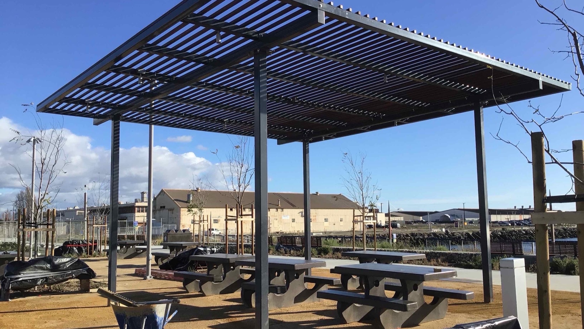 Memory care garden shade structure over a shaded courtyard seating area
