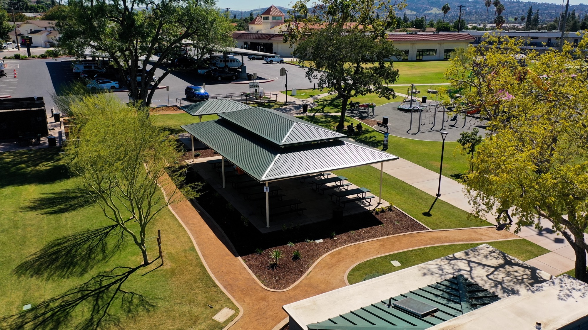 Shade structure shop drawings and submittals review of an engineered steel hip canopy over a park picnic area
